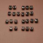 A message created by beads on a brown background.