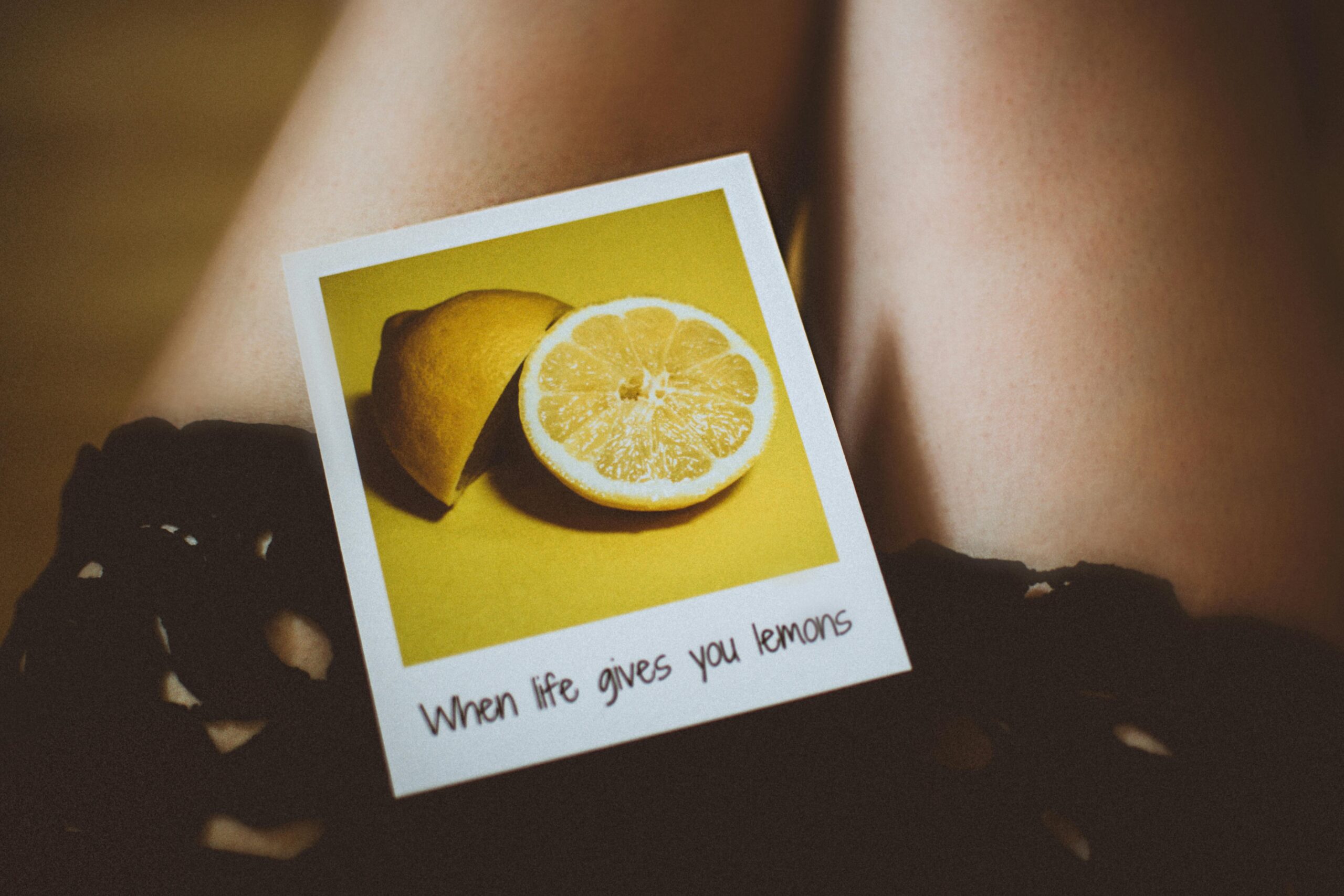 Photography of lemons and the saying "When life gives you lemons".